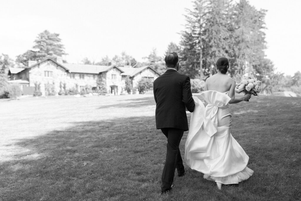 Bride and groom walking up to Willowdale Estate 