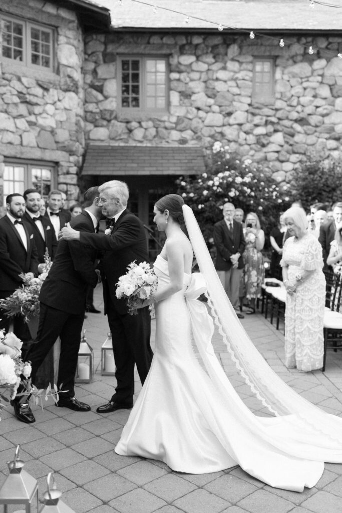 Bride and father greeting the groom at the end of the aisle for summer North Shore wedding at Willowdale Estate