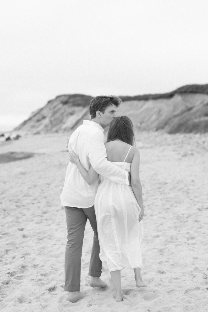 Black and white photo of couple on Moshup beach on Martha's Vineyard engagement session 