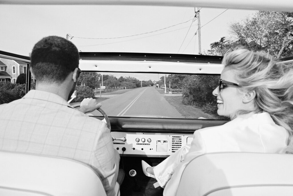 Couple portraits driving a blue bronco on Martha's Vineyard