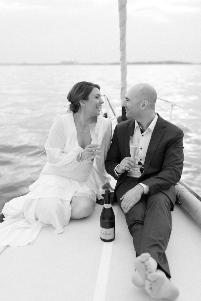 Couple drinking champagne on sailboat