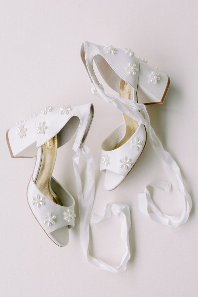 Bridal heels with pearl flowers and bow around the ankle by Forever Soles