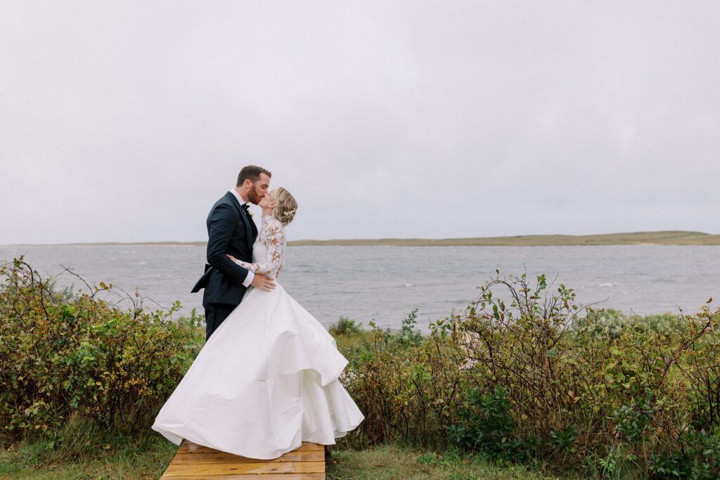 Bride and groom wedding portrait on the water for Martha's Vineyard tented wedding 