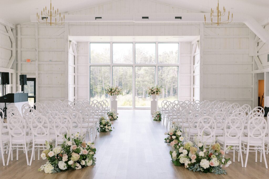 Indoor ceremony space with natural light and white space at The Greenery at McKenzie's Farm Wedding