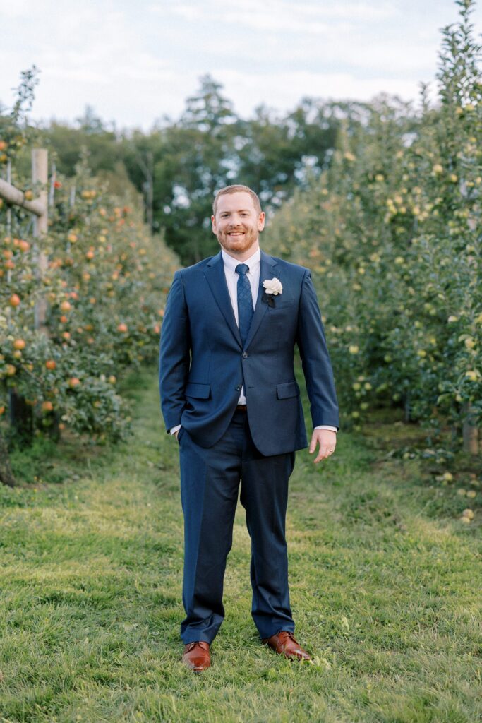 Groom portrait in the orchard at The Greenery at McKenzie's Farm Wedding 