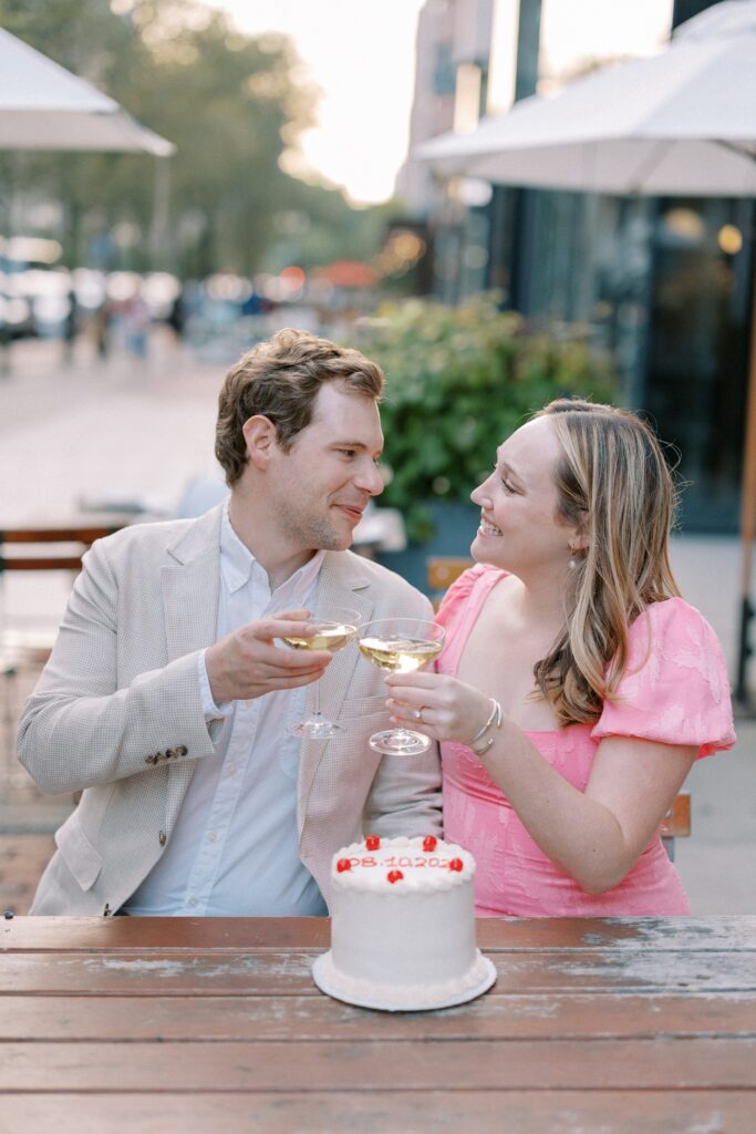 Cake and champagne toast during Boston engagement session