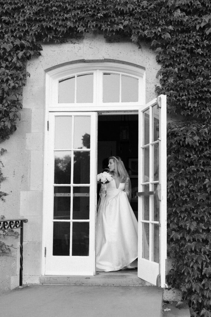 Black and white candid photo of bride at the New York Yacht Club Harbour Court in Newport