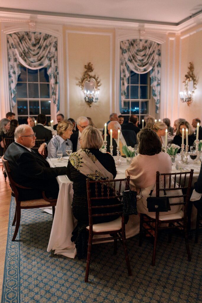 Reception space with guests seated at the New York Yacht Club Harbour Court in Newport, RI